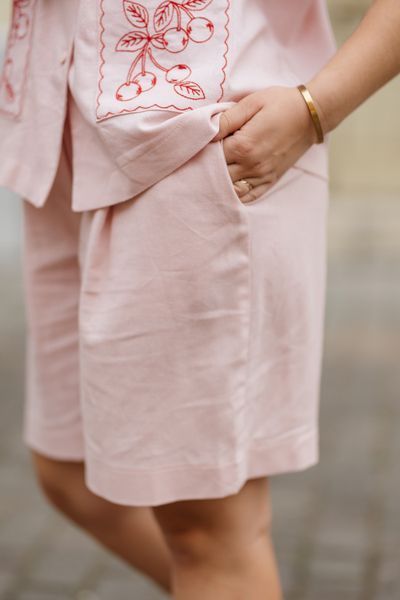 A powder-pink suit with embroidery